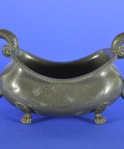 Jardinière van tin op leeuwenvoetjes