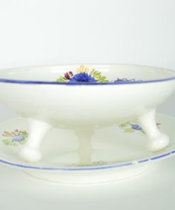 Fruittest wit aardewerk met blauwe bloem