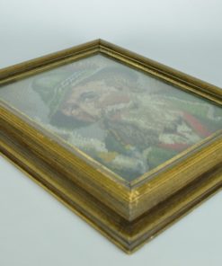 Borduurwerk van man in jagerskleding met pijp