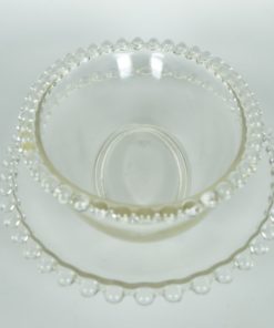 Ovale schaal en schotel met glazen parelrand van kleurloos glas