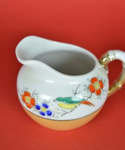 Schenkkan met vogel en parelmoerglazuur - porselein