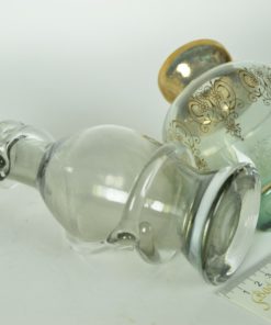 Twee vaasjes turquoise en grijs glas met glazen lint en gouden accenten